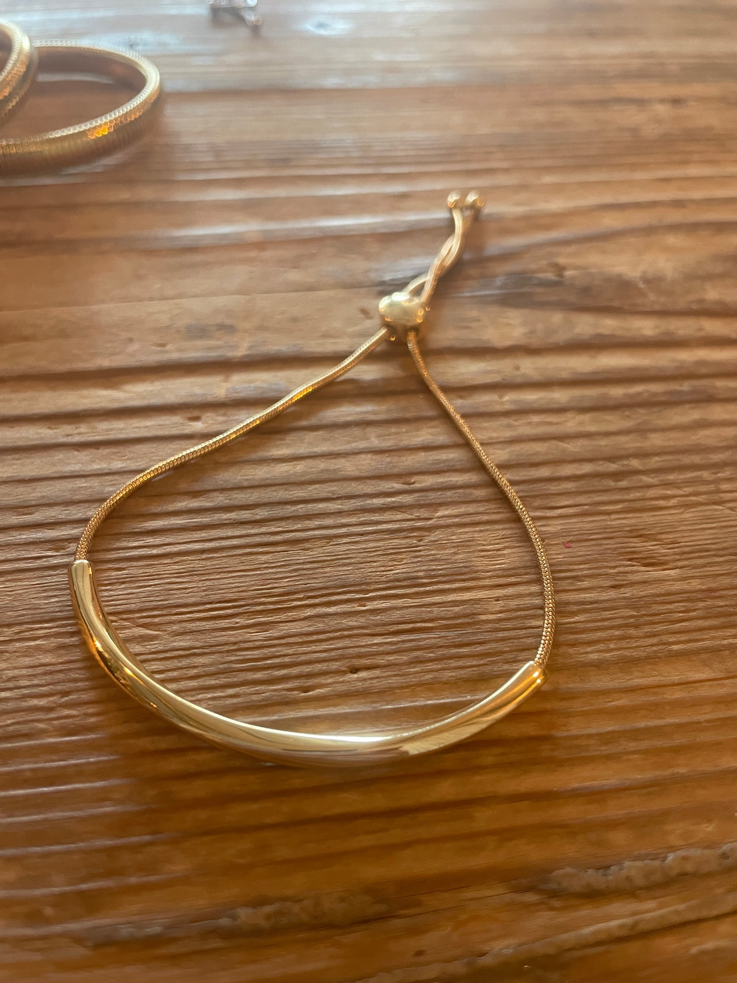 simple curved bar lariat style bracelet